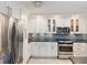 The modern kitchen features stainless steel appliances, ample storage, and sleek granite countertops at 1400 Gulf Blvd # 701, Clearwater Beach, FL 33767