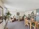 Lounge area with comfortable sofas, armchairs, tables and bookshelf at 1400 Gulf Blvd # 701, Clearwater Beach, FL 33767