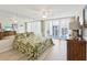 Bright main bedroom with tropical bedding and balcony access at 1400 Gulf Blvd # 701, Clearwater Beach, FL 33767