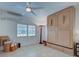 Bright bedroom with tile floors, ceiling fan, and murphy bed is ready for guests! at 401 Sunset Dr, Venice, FL 34285