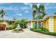 Stunning home with vibrant landscaping, featuring a beautiful fountain and a bright, sunny ambiance at 401 Sunset Dr, Venice, FL 34285