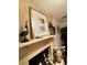 Cozy fireplace featuring nautical décor and a mantel at 401 Sunset Dr, Venice, FL 34285