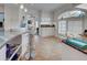 Bright kitchen features stainless steel appliances, granite countertops, and tiled floors at 401 Sunset Dr, Venice, FL 34285