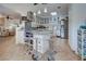 Modern kitchen with stainless steel appliances, island with seating, and stylish pendant lighting at 401 Sunset Dr, Venice, FL 34285
