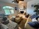 Comfortable living room with fireplace, stylish furniture, and abundant natural light at 401 Sunset Dr, Venice, FL 34285
