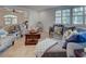 Inviting living room with comfortable seating, decorative pillows, and abundant natural light at 401 Sunset Dr, Venice, FL 34285