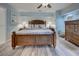 Comfortable main bedroom with rustic wood furniture and decor at 401 Sunset Dr, Venice, FL 34285