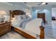 Bedroom featuring a wooden bed, nautical decor, and luxury vinyl plank flooring at 401 Sunset Dr, Venice, FL 34285