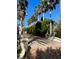 View of the walkway lined with trees and brick pathway, creating a sense of privacy and beauty at 401 Sunset Dr, Venice, FL 34285