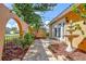 Charming back patio with a fountain and archways at 16601 W Course Dr, Tampa, FL 33624