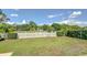 Lush, well-maintained backyard with green lawn and white picket fence, providing a serene outdoor space at 16601 W Course Dr, Tampa, FL 33624