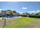 A spacious backyard with a pool, patio, and lush greenery, offering ample space for outdoor activities and relaxation at 16601 W Course Dr, Tampa, FL 33624