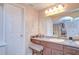 Bathroom with long vanity and a view into the bedroom at 16601 W Course Dr, Tampa, FL 33624