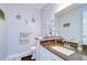 Cozy bathroom with gray walls, decorative art, and granite countertop at 16601 W Course Dr, Tampa, FL 33624