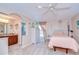 Bedroom and adjoining bathroom offer an open layout with great lighting at 16601 W Course Dr, Tampa, FL 33624