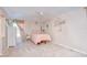 Bright bedroom features a ceiling fan and neutral colored walls and carpet at 16601 W Course Dr, Tampa, FL 33624