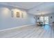 Spacious dining room with wood-look floors and sliding glass doors at 16601 W Course Dr, Tampa, FL 33624