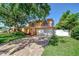 Beautiful two-story home featuring balconies and a brick-paved driveway at 16601 W Course Dr, Tampa, FL 33624