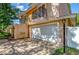 View of a home's white garage and attached walkway with arches at 16601 W Course Dr, Tampa, FL 33624