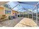 Charming patio with brick flooring, cozy seating, and a view of the backyard, ideal for outdoor living at 16601 W Course Dr, Tampa, FL 33624