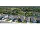An aerial photograph of residences, lush vegetation, and a clear blue sky in the background at 3270 Rock Sound St, Bradenton, FL 34208