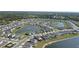 A bird's eye view of a community featuring homes, lakes, and lush greenery at 3270 Rock Sound St, Bradenton, FL 34208