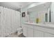 Well-lit bathroom with double sinks, a large mirror, and a shower-tub combo, ideal for everyday convenience at 3270 Rock Sound St, Bradenton, FL 34208