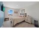 Inviting bedroom with a window, a comfortable bed, and calming decor, creating a serene and relaxing atmosphere at 3270 Rock Sound St, Bradenton, FL 34208