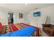 Bright bedroom featuring Southwestern-themed decor, sitting area and closet access at 3270 Rock Sound St, Bradenton, FL 34208