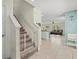 Entryway with staircase and a view into the living room and kitchen at 3270 Rock Sound St, Bradenton, FL 34208