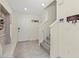 Welcoming entryway with tile flooring, coat rack and stair access to the upper level at 3270 Rock Sound St, Bradenton, FL 34208