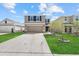 Charming two-story home with a well-manicured lawn and attached two-car garage at 3270 Rock Sound St, Bradenton, FL 34208