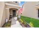 Welcoming front porch with an American flag, seating, and decorative plants and mulch at 3270 Rock Sound St, Bradenton, FL 34208