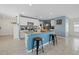 Bright kitchen with granite countertops, stainless appliances, and a central island with bar stool seating at 3270 Rock Sound St, Bradenton, FL 34208