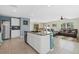 Open floor plan features an island, stainless steel appliances, and a cozy seating area at 3270 Rock Sound St, Bradenton, FL 34208
