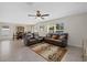 Comfortable living room with recliner seating, patterned rug, and an adjacent dining area at 3270 Rock Sound St, Bradenton, FL 34208