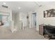 Bright loft area featuring neutral carpet, access to bedrooms, and a study nook at 3270 Rock Sound St, Bradenton, FL 34208