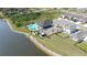 Community clubhouse and pool area located by the lake and lush greenery at 3270 Rock Sound St, Bradenton, FL 34208