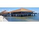 Waterfront building featuring a copper roof and a deck overlooking the water at 632 Edgewater Dr # 832, Dunedin, FL 34698