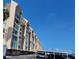 Condo building on sunny day with covered parking at 632 Edgewater Dr # 832, Dunedin, FL 34698