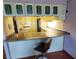 A kitchen view showcasing a bar countertop and dark wood flooring at 632 Edgewater Dr # 832, Dunedin, FL 34698