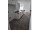 Kitchen showcasing white cabinetry and grey granite countertops at 1544 Blue Bayou Cir, Ruskin, FL 33570