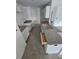 Kitchen featuring white cabinetry and grey granite countertops with an island at 1544 Blue Bayou Cir, Ruskin, FL 33570