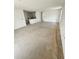 Spacious living room with bare concrete flooring awaiting new finish at 1544 Blue Bayou Cir, Ruskin, FL 33570