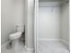 Bathroom featuring a toilet and an open closet at 5136 Cedar Hammock Dr, Sarasota, FL 34232
