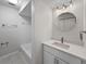 Updated bathroom with quartz countertops, undermount sink, and tile floors at 5136 Cedar Hammock Dr, Sarasota, FL 34232
