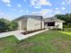 Charming single-story home featuring a well-manicured lawn and an attached garage with a neutral color palette at 5136 Cedar Hammock Dr, Sarasota, FL 34232