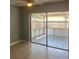 Dining room with sliding glass doors leading to the screened porch at 7169 Holiday Dr, Spring Hill, FL 34606