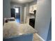 Kitchen featuring a breakfast bar and views of the backyard at 7169 Holiday Dr, Spring Hill, FL 34606