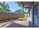 Backyard features a brick patio, a wooden fence, and green foliage at 6443 34Th N Ave, St Petersburg, FL 33710